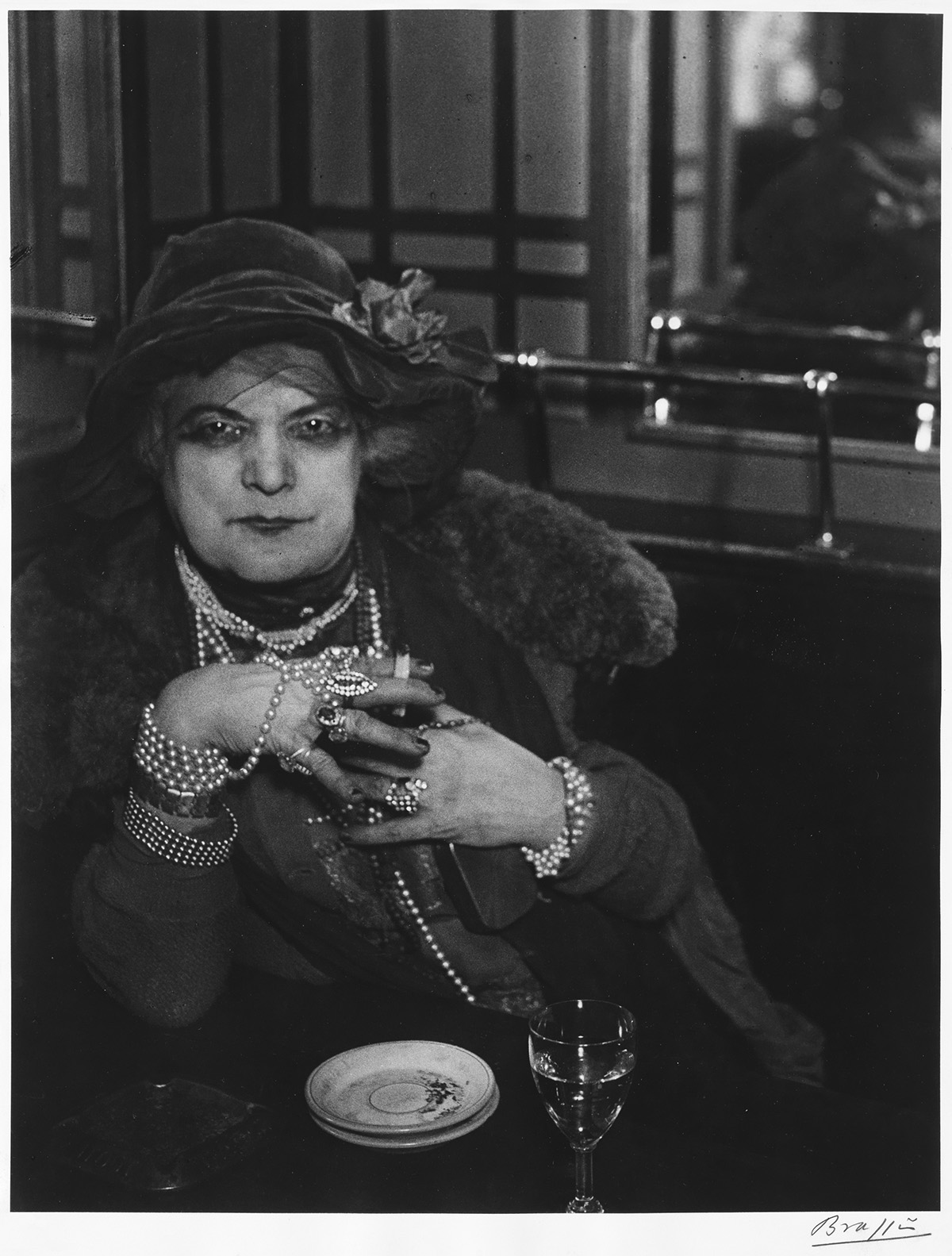 BRASSAÏ (1899-1984) Madame Bijou at the Bar de la Lune, Paris.